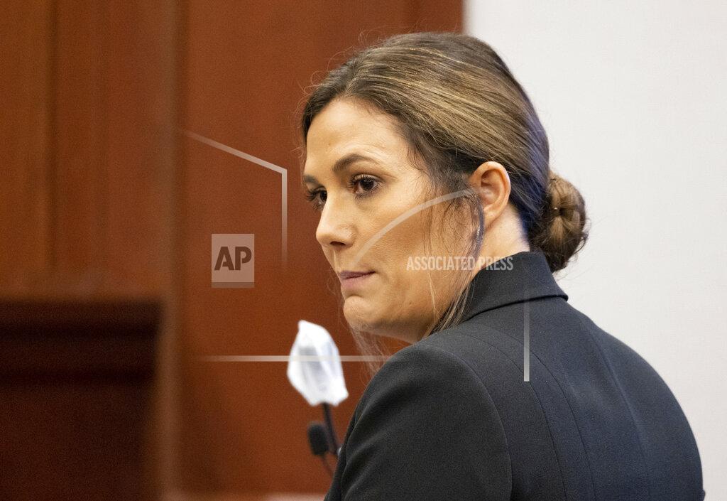 Ben Gray District Attorney Shannon Wallace speaks during the plea hearing for Robert Aaron Long in Superior Court of Cherokee County in Canton, Ga., on Tuesday, July 27, 2021. Long, accused of killing eight people, most of them women of Asian descent, at Atlanta-area massage businesses pleaded guilty to four of the murders. He was handed four sentences of life without parole. (Ben Gray/Atlanta Journal-Constitution via AP, Pool)