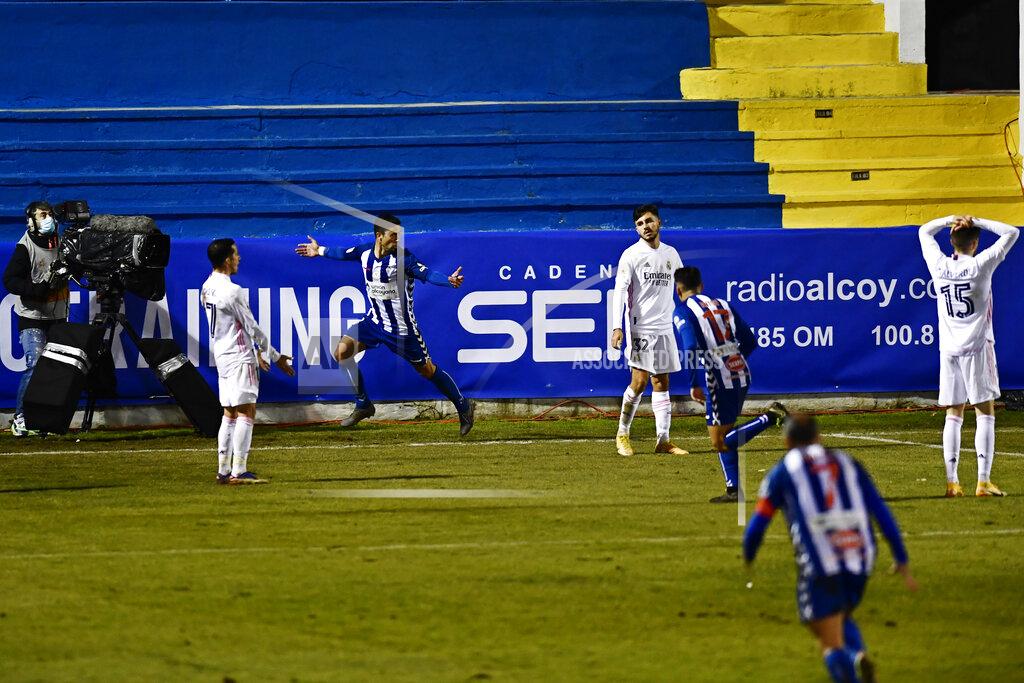 Jose Breton Alcoyano's Juanan, 2nd left, celebrates after scoring his side's second goal to knock out Real Madrid during a Spanish Copa del Rey round of 32 soccer match between Alcoyano and Real Madrid at the El Collao stadium in Alcoy, Spain, Wednesday Jan. 20, 2021. (AP Photo/Jose Breton)