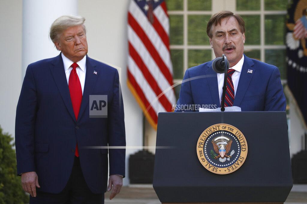 Alex Brandon FILE - In this March 30, 2020 file photo, My Pillow CEO Mike Lindell speaks as President Donald Trump listens during a briefing about the coronavirus in the Rose Garden of the White House, in Washington. Lindell, is weighing a run for governor in Minnesota. If he follows through on a campaign, it could be an early test of where the Republican Party is headed in the post-Donald Trump era. (AP Photo/Alex Brandon, File)