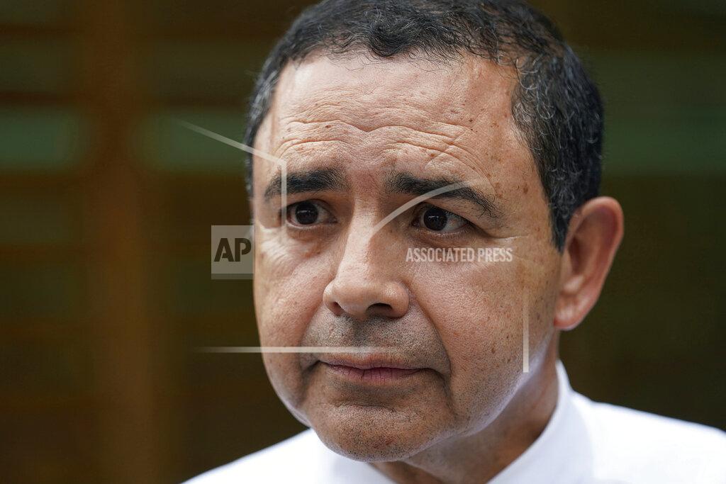 Eric Gay FILE - U.S. Rep. Henry Cuellar, D-Laredo, talks to a member of the media during a campaign event, on Wednesday, May 4, 2022, in San Antonio. Cuellar, a 17-year incumbent is facing a May 24, 2022, Democratic primary runoff against progressive Jessica Cisneros. (AP Photo/Eric Gay File)