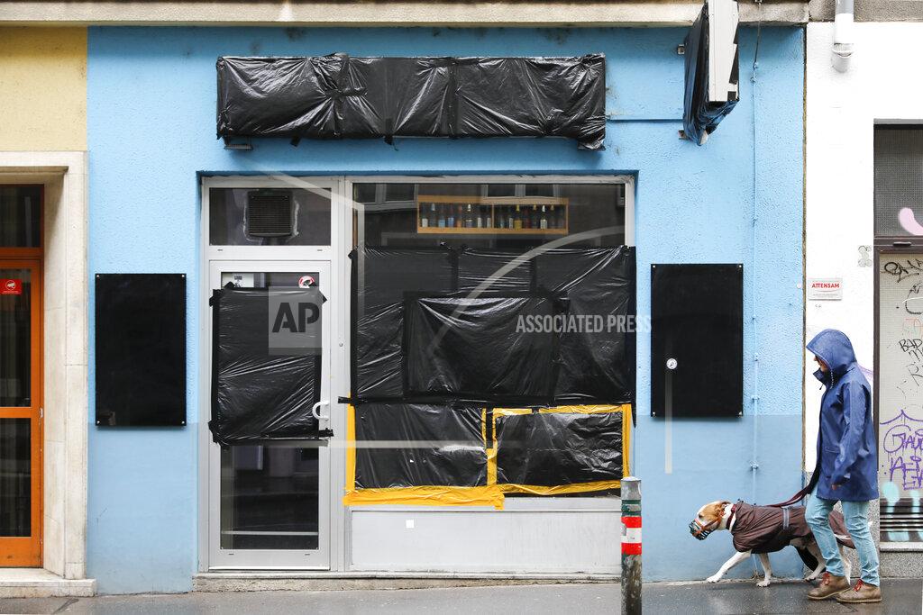 Lisa Leutner The former beer shop belonging to the man who recently shot his former girlfriend in Vienna, Austria, Friday, May 14, 2021. The glass front is taped up in black foil since it was smashed after the murder. A memorial for Nadine, a woman who was killed on April 5 by her former partner, is set up at the on the Yppenplatz square in Vienna, Austria, Friday, May 14, 2021. Austria is one of the few European Union countries where the number of women killed is higher than the number of men. The recent high-profile cases have led to widespread protests, demands for government intervention and condemnations from top politicians. (AP Photo/Lisa Leutner)