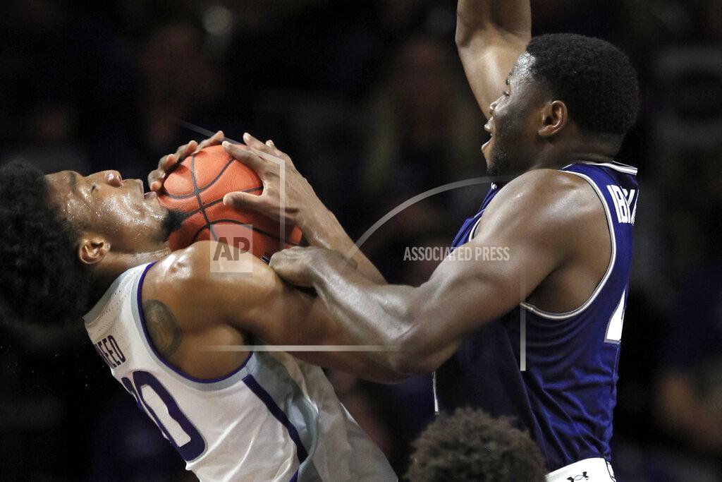 Orlin Wagner Kansas State forward Xavier Sneed, left, is fouled by Monmouth center Sam Ibiezugbe during the first half of an NCAA college basketball game in Manhattan, Kan., Wednesday, Nov. 13, 2019. (AP Photo/Orlin Wagner)