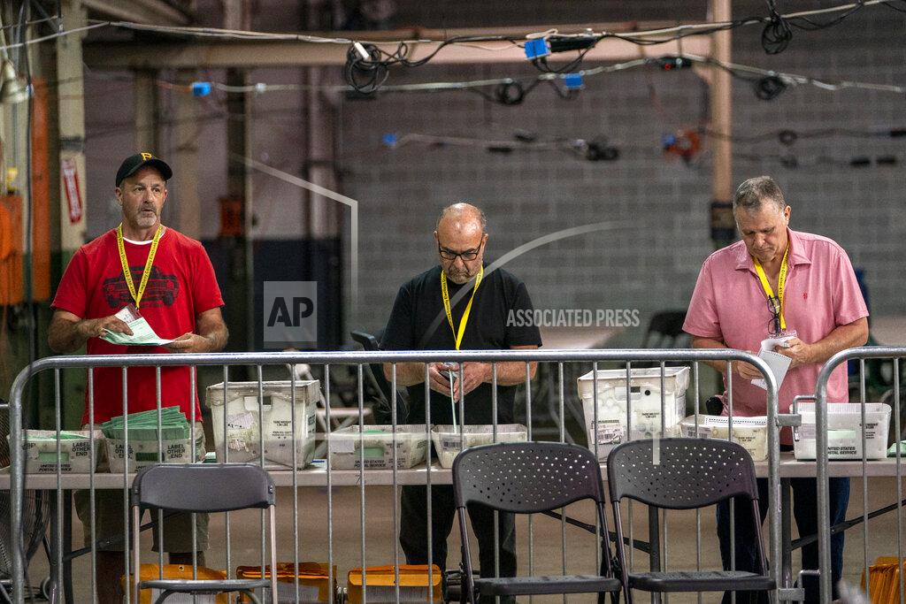 Alexandra Wimley Allegheny County elections workers open and begin to process provisional ballots that were not challenged by campaign representatives, Monday, May 23, 2022, on the North Side neighborhood of Pittsburgh. (Alexandra Wimley