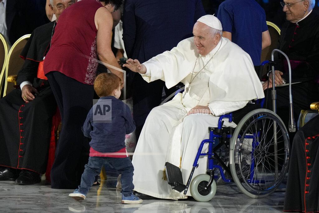 Andrew Medichini Pope Francis reaches out to a young boy as he attends the Festival of Families in the Paul VI Hall at the Vatican, on the first day of the World Meeting of Families, Wednesday, June 22, 2022. (AP Photo/Andrew Medichini)