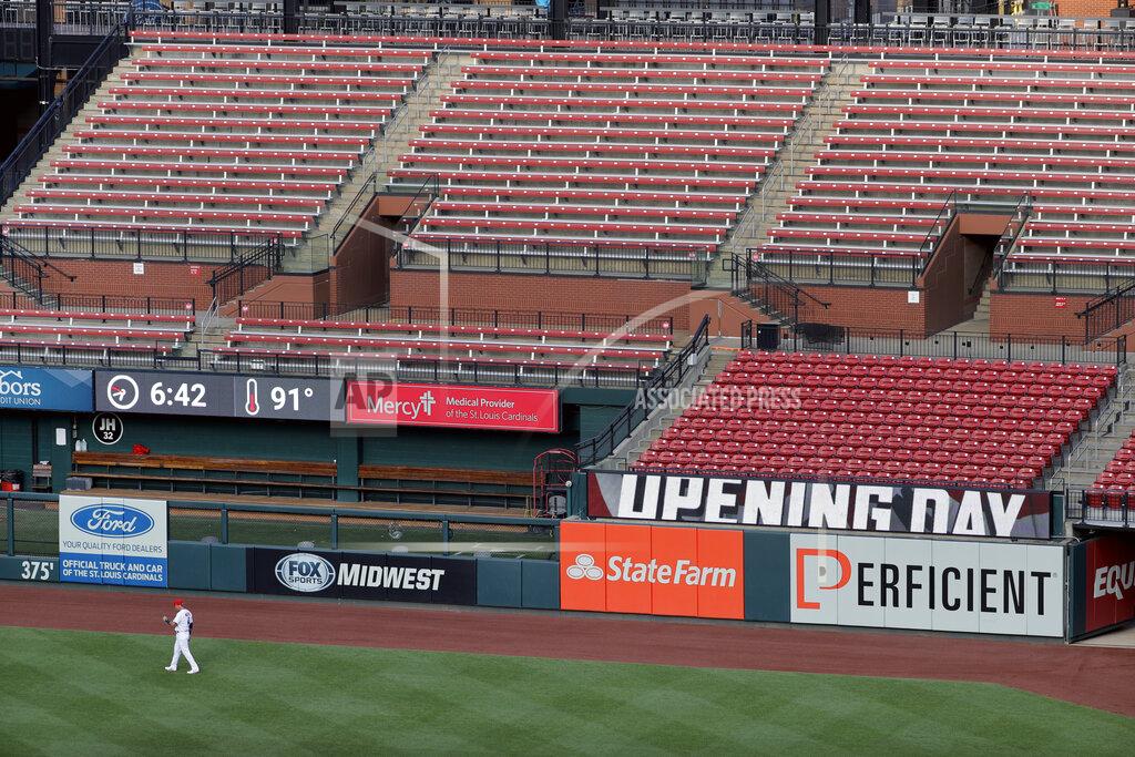Jeff Roberson St. Louis Cardinals catcher Yadier Molina warms up in front of empty seats before the start of an opening day baseball game against the Pittsburgh Pirates Friday, July 24, 2020, in St. Louis. (AP Photo/Jeff Roberson)