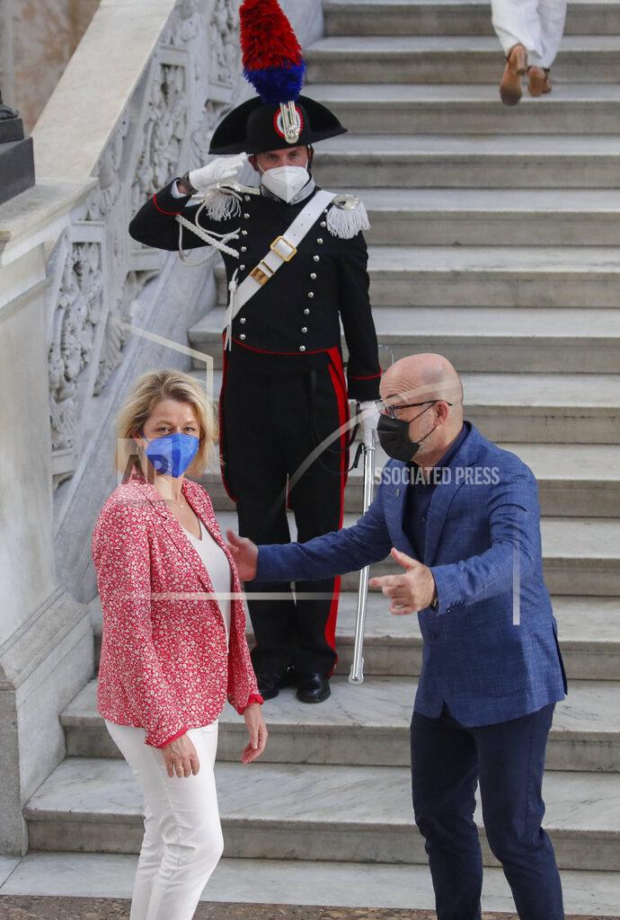 Salvatore Laporta Italian Minister for Ecological Transition Roberto Cingolani, right, welcomes welcomes his French homologue Barbara Pompili as she arrives at Palazzo Reale in Naples, Italy, Thursday, July 22, 2021, to take part in a G20 meeting on environment, climate and energy. (AP Photo/Salvatore Laporta)