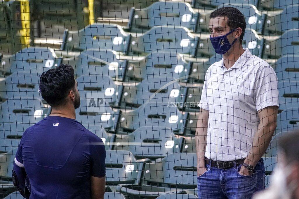 Morry Gash Milwaukee Brewers general manager David Stearns talks to Ryan Braun during a practice session Saturday, July 4, 2020, at Miller Park in Milwaukee. (AP Photo/Morry Gash)