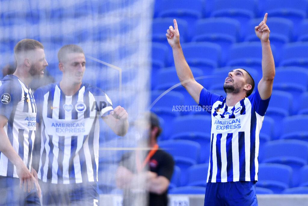 Mike Hewitt Brighton's Neal Maupay, right, celebrates after scoring his side's second goal during the English Premier League soccer match between Brighton & Hove Albion and Arsenal at the AMEX Stadium in Brighton, England, Saturday, June 20, 2020. (Mike Hewitt/Pool via AP)