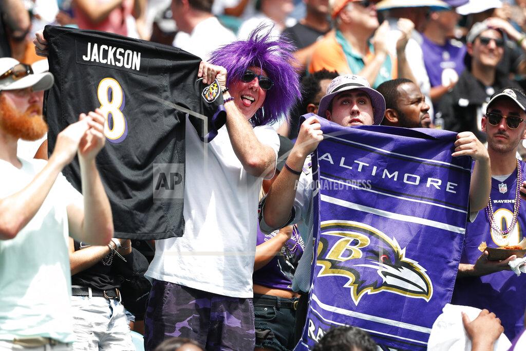 Wilfredo Lee Baltimore Ravers cheer the team, during the first half at an NFL football game against the Miami Dolphins, Sunday, Sept. 8, 2019, in Miami Gardens, Fla. (AP Photo/Wilfredo Lee)