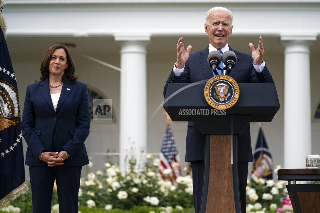 Evan Vucci Vice President Kamala Harris listens as President Joe Biden speaks on updated guidance on mask mandates, in the Rose Garden of the White House, Thursday, May 13, 2021, in Washington. (AP Photo/Evan Vucci)