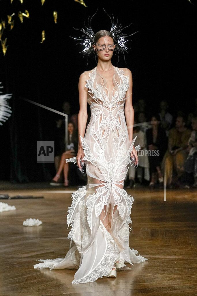 Michel Euler A model wears a creation as part of Iris van Herpen Haute Couture Fall/Winter 2022-2023 fashion collection presented Monday, July 4, 2022 in Paris. (AP Photo/Michel Euler)