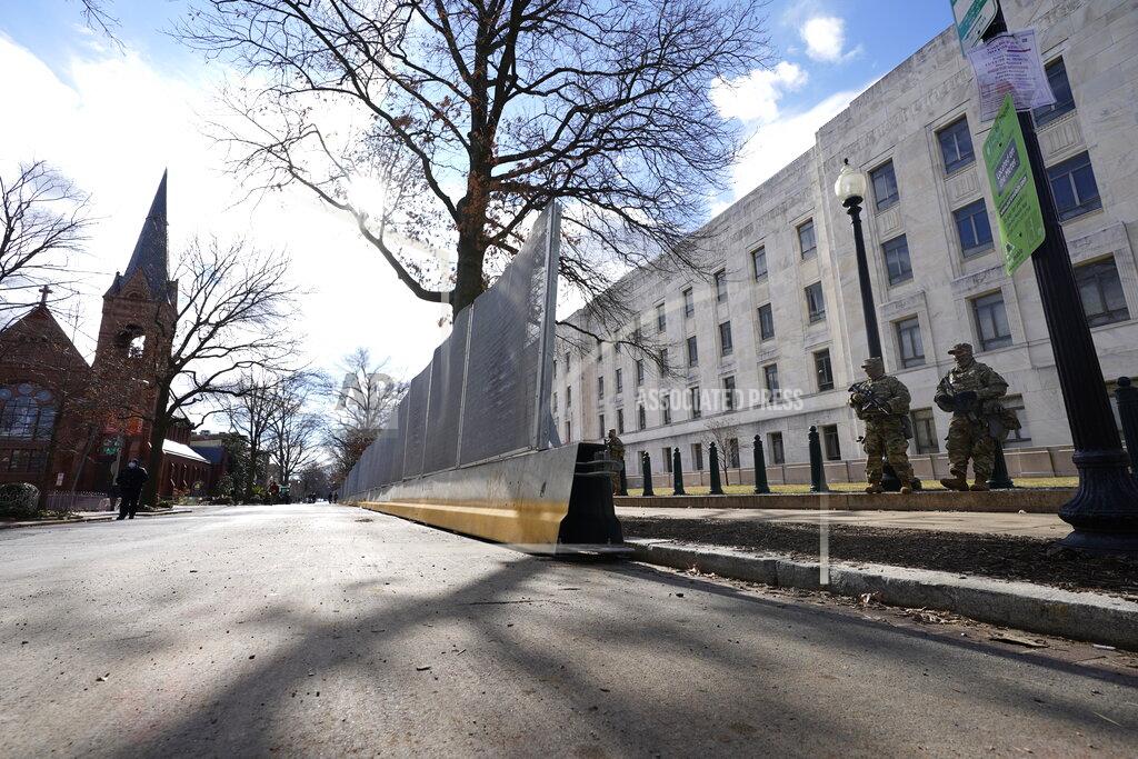 Julio Cortez National Guard stand outside the Supreme Court as security is increased around the Court ahead of the inauguration of President-elect Joe Biden and Vice President-elect Kamala Harris, Sunday, Jan. 17, 2021, in Washington, Sunday, Jan. 17, 2021. (AP Photo/Julio Cortez)