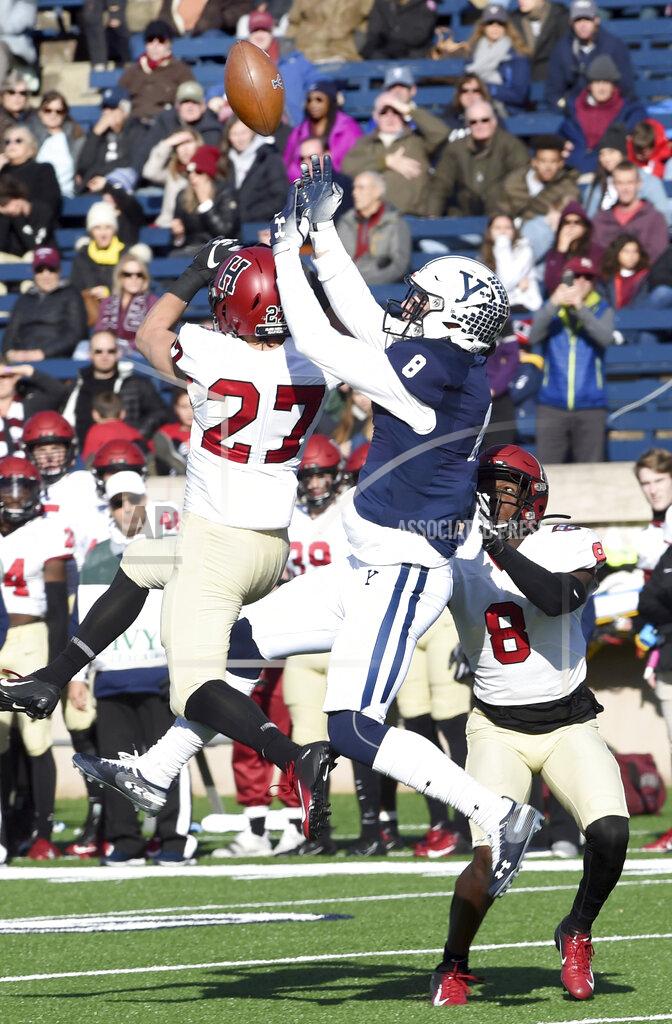 Arnold Gold Harvard's Cody Thompson, left, breaks up a pass play to Yale's Patrick Conte during the first half during an NCAA college football game, Saturday, Nov. 23, 2019, in New Haven, Conn. (Arnold Gold/New Haven Register via AP)