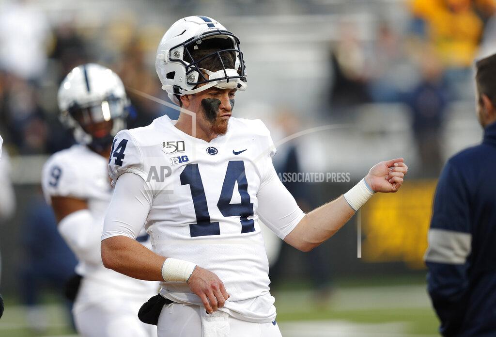 Matthew Putney Penn State quarterback Sean Clifford plays the air guitar during warmups for the team's NCAA college football game against Iowa, Saturday, Oct. 12, 2019, in Iowa City, Iowa. (AP Photo/Matthew Putney)