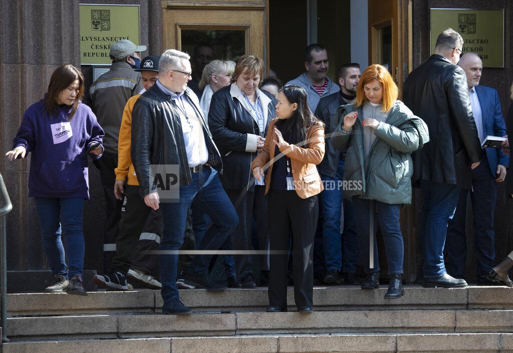 Pavel Golovkin Embassy staff gather before some of them will leave the Czech Republic Embassy in Moscow, Russia, Monday, April 19, 2021. Russia has ordered 20 Czech diplomats to leave the country within a day in response to Prague's expulsion of 18 Russian diplomats. The Czech government has alleged the Russian Embassy staffers were spies for a military intelligence agency that was involved in a fatal ammunition depot explosion in 2014. (AP Photo/Pavel Golovkin)