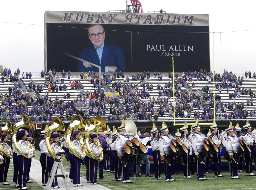 Ted S. Warren Members Washington Huskies band stand on the field during a moment of silence in tribute to Microsoft founder and philanthropist Paul Allen, who died Monday, Oct. 15, 2018, before an NCAA college football game between Washington and Colorado, Saturday, Oct. 20, 2018, in Seattle. (AP Photo/Ted S. Warren)