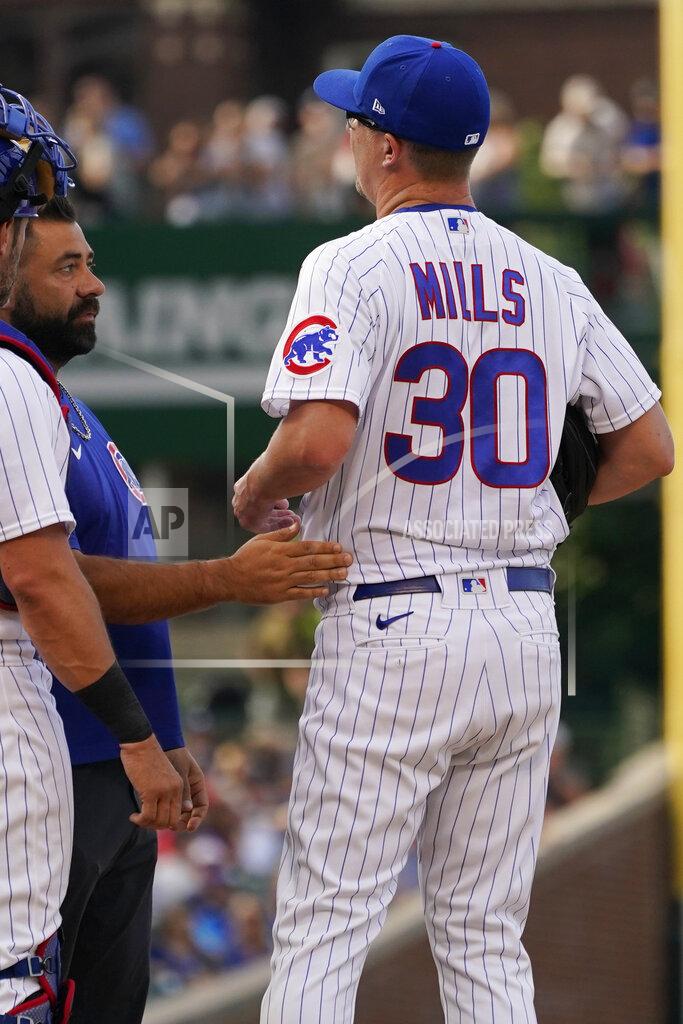 Nam Y. Huh Chicago Cubs starting pitcher Alec Mills, right, is checked by a team trainer after an injury during the first inning of the team's baseball game against the Boston Red Sox in Chicago, Saturday, July 2, 2022. (AP Photo/Nam Y. Huh)