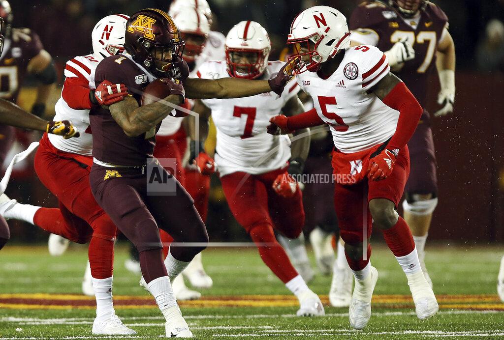 Stacy Bengs Minnesota running back Rodney Smith (1) holds off Nebraska cornerback Cam Taylor-Britt during an NCAA college football game Saturday, Oct. 12, 2019, in Minneapolis. (AP Photo/Stacy Bengs)