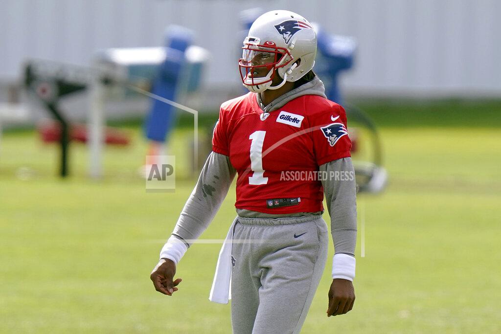 Steven Senne New England Patriots quarterback Cam Newton walks on the field during an NFL football training camp practice, Wednesday, Aug. 26, 2020, in Foxborough, Mass. (AP Photo/Steven Senne, Pool)