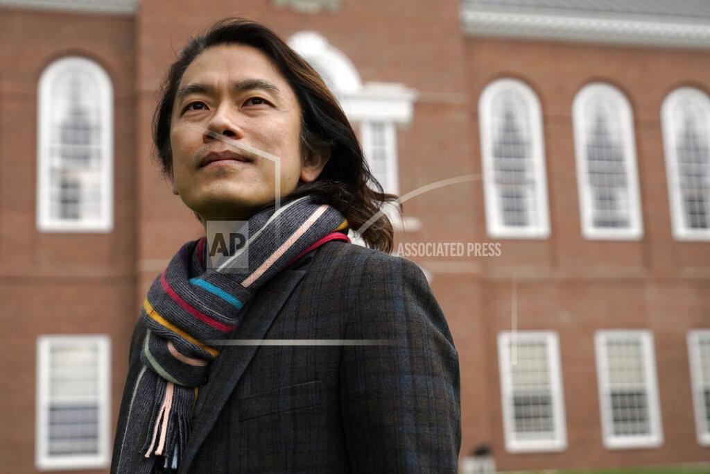 Steven Senne Eng-Beng Lim, a professor at Dartmouth College, stands for a photograph on the school's campus, Tuesday, April 20, 2021, in Hanover, N.H. A wave of anti-Asian attacks that started more than a year ago with the pandemic, along with the March 2021 shootings in Atlanta that left six Asian women dead, have provoked national conversations about the visibility of Asian Americans. (AP Photo/Steven Senne)