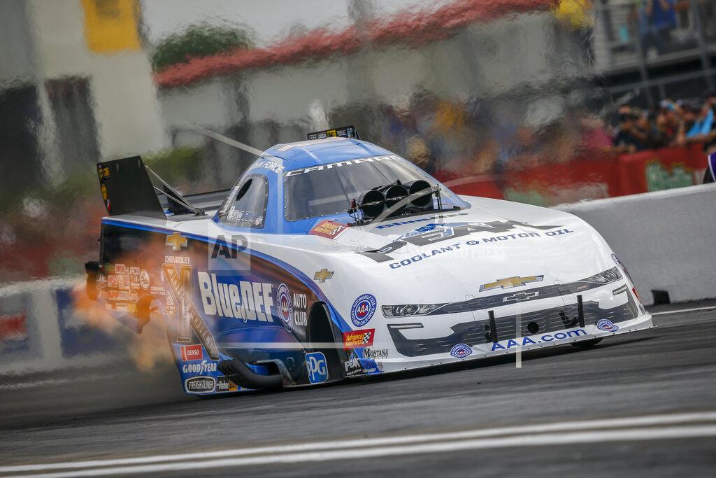 Randy Anderson In this photo provided by the NHRA, John Force drives in Funny Car qualifying at the Mopar Express Lane NHRA SpringNationals drag races at Houston Raceway Park on Friday, April 12, 2019, in Baytown, Texas. (Randy Anderson/NHRA via AP)