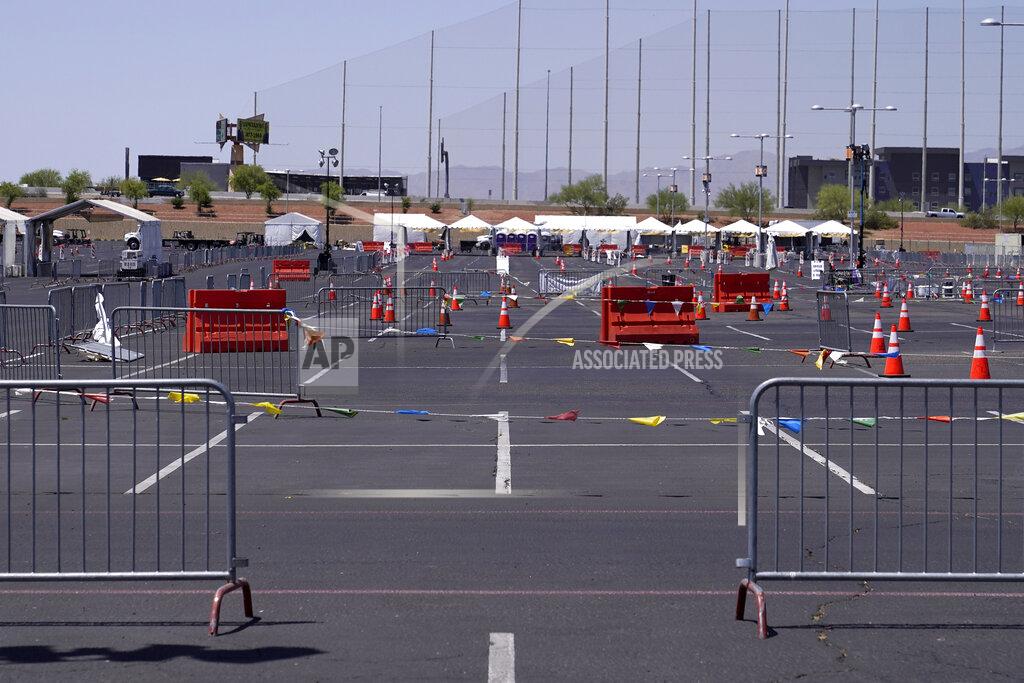 Ross D. Franklin A once bustling Arizona state-run COVID-19 mass-vaccination site at State Farm Stadium closed Friday, April 23, 2021, in Glendale, Ariz. Arizona continues to transition outdoor operations to indoor venues. (AP Photo/Ross D. Franklin)