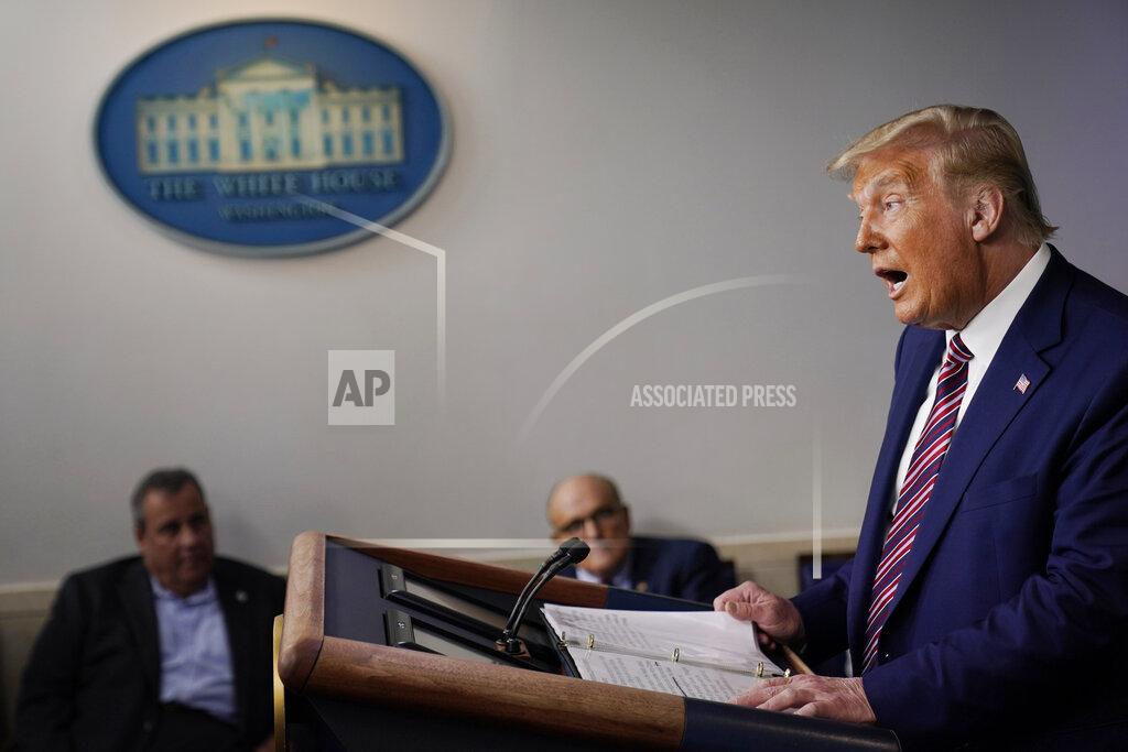 Former New Jersey Gov. Chris Christie, and former New York Mayor Rudy Giuliani look on as President Donald Trump speaks during a news conference at the White House, Sunday, Sept. 27, 2020, in Washington. (AP Photo/Carolyn Kaster)