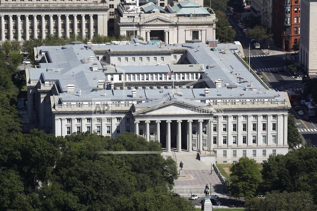 This Sept. 18, 2019 photo shows the U.S. Treasury Department building viewed from the Washington Monument in Washington. The Treasury Department says it will need to borrow a record $2.99 trillion during the current April-June quarter to cover the cost of various rescue efforts dealing with the coronavirus pandemic. Treasury said Monday, May 4, 2020 that the $2.99 trillion it plans to borrow this quarter will far surpass the $530 billion quarterly borrowing it did in the July-September 2008 quarter as it dealt with the 2008 financial crisis. The extraordinary sum of $2.99 trillion of borrowing in a single quarter dwarfs the $1.28 trillion the government borrowed in the bond market for all of 2019. (AP Photo/Patrick Semansky)