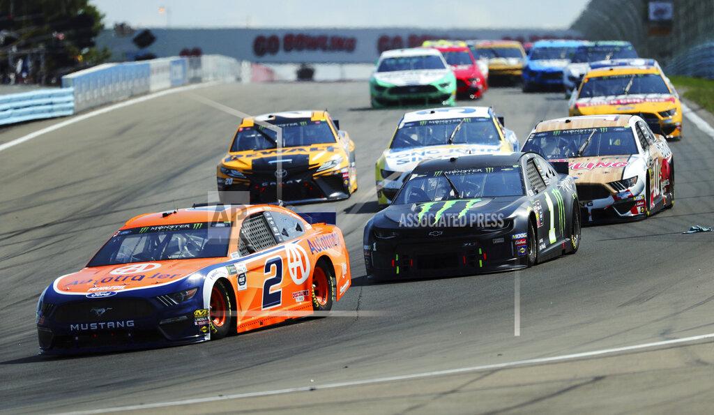 John Munson Brad Keselowski (2) and Kurt Busch (1) head into Turn 1 during a NASCAR Cup Series auto race at Watkins Glen International, Sunday, Aug. 4, 2019, in Watkins Glen, N.Y. (AP Photo/John Munson)