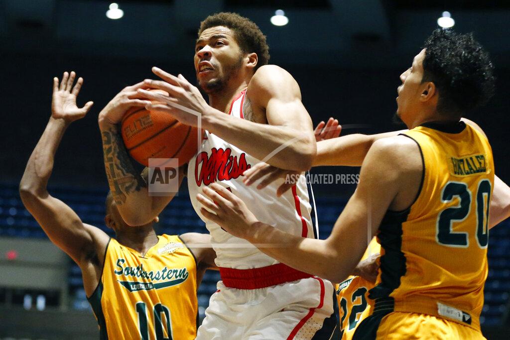 Rogelio V. Solis Mississippi forward KJ Buffen (5) protects a rebound from Southeastern Louisiana forward Brandon Gonzalez (20) and guard Von Julien (10) during the first half of an NCAA college basketball game, Saturday, Dec. 21, 2019, in Jackson, Miss. Mississippi won 83-76. (AP Photo/Rogelio V. Solis)