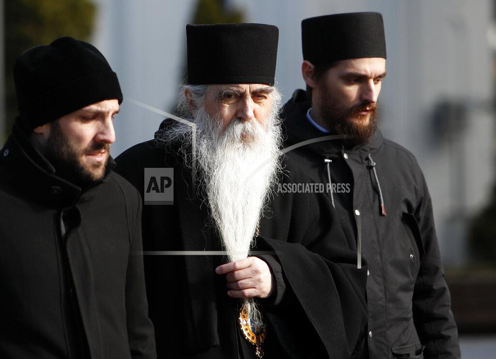 Darko Vojinovic Serbian Orthodox Church bishop Irinej Bulovic, centre, arrives in the St. Sava temple before church closed session in Belgrade, Serbia, Thursday, Feb. 18, 2021. The Serbian Orthodox Church gathers in closed session to pick a new Patriarch, following the death of old one Irinej. Irinej died last year of COVID, following the outbreak of virus among church officials in Belgrade. (AP Photo/Darko Vojinovic)