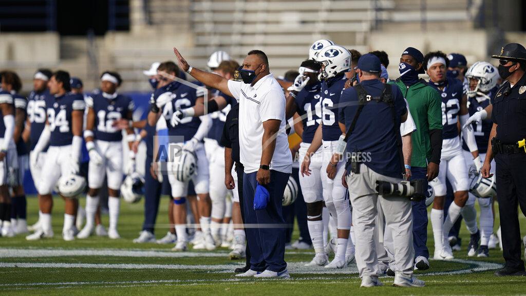 Rick Bowmer BYU head coach Kalani Sitake, center, walks onto the field following an NCAA college football game against UTSA, Saturday, Oct. 10, 2020, in Provo, Utah. (AP Photo/Rick Bowmer, Pool)