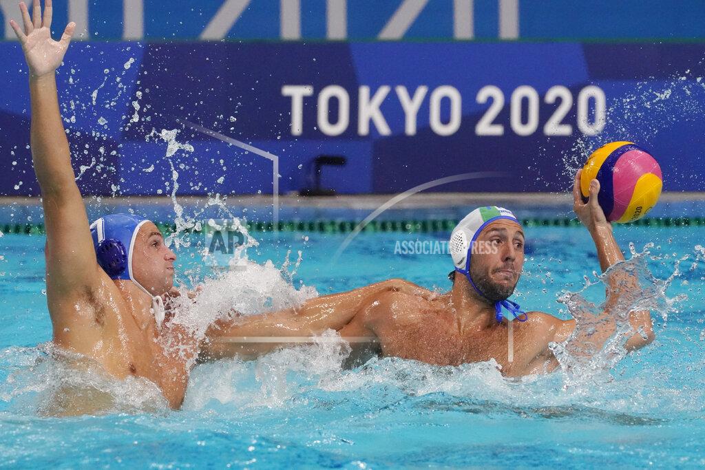 Mark Humphrey Italy's Gonzalo Echenique, right, is defended by Greece's Georgios Dervisis, left, during a preliminary round men's water polo match at the 2020 Summer Olympics, Tuesday, July 27, 2021, in Tokyo, Japan. (AP Photo/Mark Humphrey)
