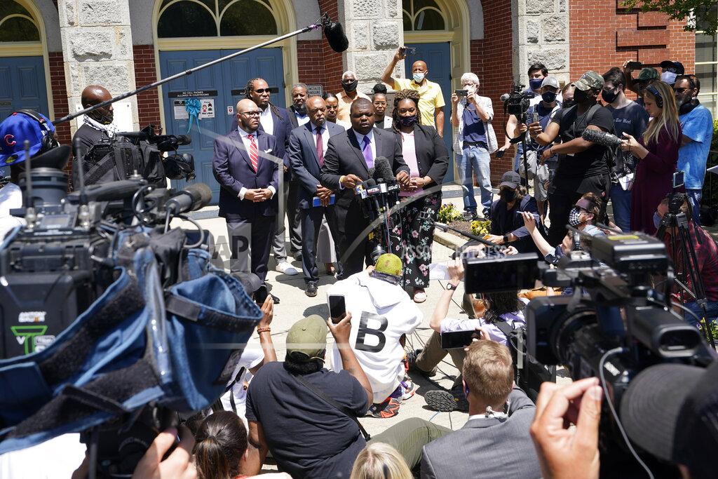 Steve Helber Attorneys for the family of Andrew Brown, Harry Daniel, at podium, makes comments after a judges decision on the release body cam video of the shooting of Andrew Brown Jr. in Elizabeth City, N.C., Wednesday, April 28, 2021. A judge denied the request to immediately release body cam video of the incident. (AP Photo/Steve Helber)
