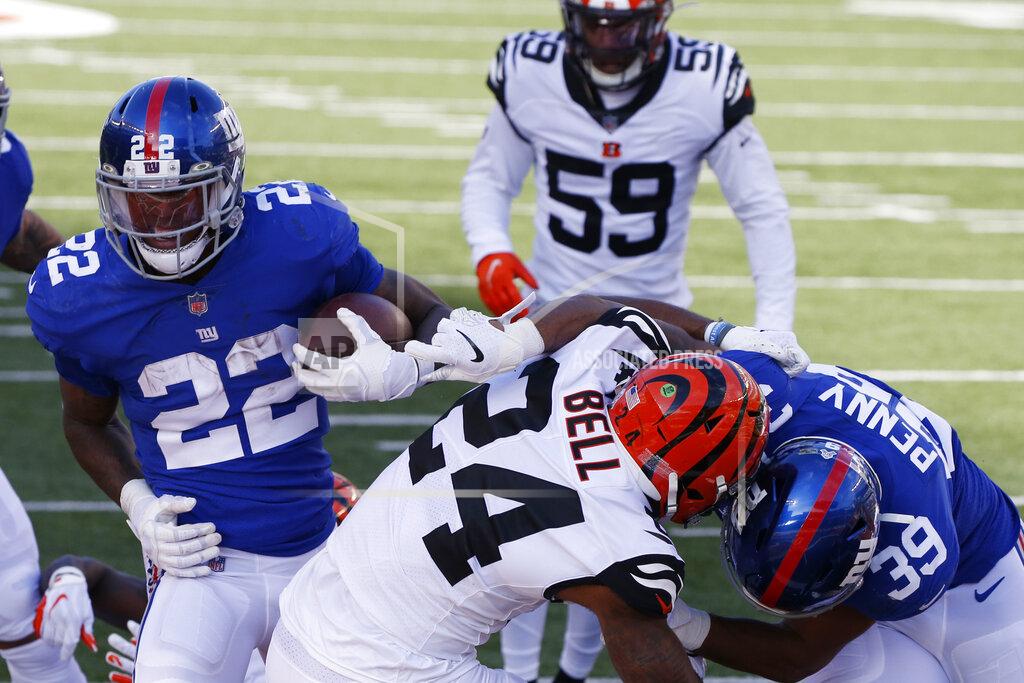 Gary Landers New York Giants running back Wayne Gallman (22) rushes for a 1-yard touchdown during the first half of NFL football game against the Cincinnati Bengals, Sunday, Nov. 29, 2020, in Cincinnati. (AP Photo/Gary Landers)