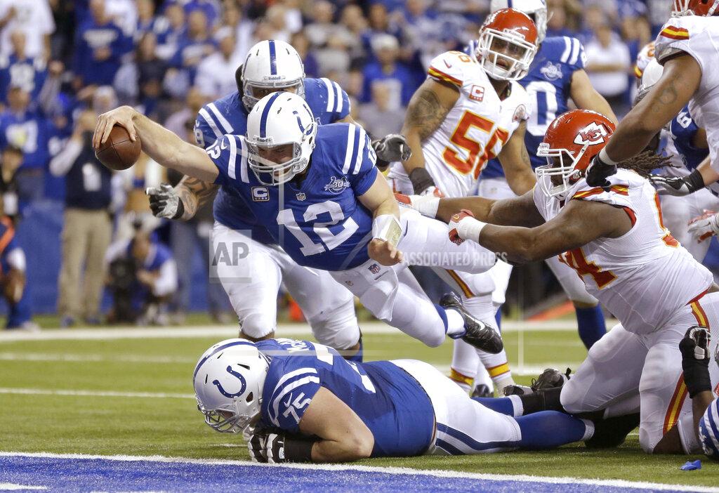 Michael Conroy FILE - In this Jan. 4, 2014, file photo, Indianapolis Colts quarterback Andrew Luck (12) dives for a touchdown after recovering a fumble by the Colts' Eric Berry during the second half of an NFL wild-card playoff football game against the Kansas City Chiefs, in Indianapolis. Given the postseason history involving Indianapolis and Kansas City over the years, Andrew Luck and the Colts have every reason to feel confident heading to Arrowhead Stadium on Saturday.(AP Photo/Michael Conroy, File)