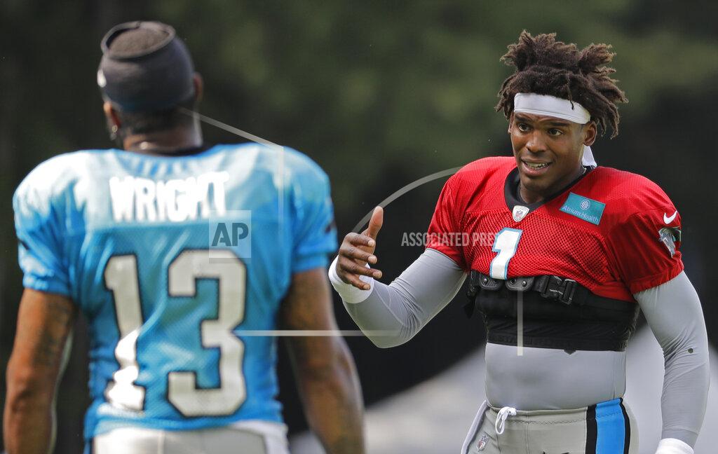 Chuck Burton Carolina Panthers' Cam Newton (1) talks with Jarius Wright (13) during practice at the NFL football team's training camp in Spartanburg, S.C., Sunday, July 28, 2019. (AP Photo/Chuck Burton)