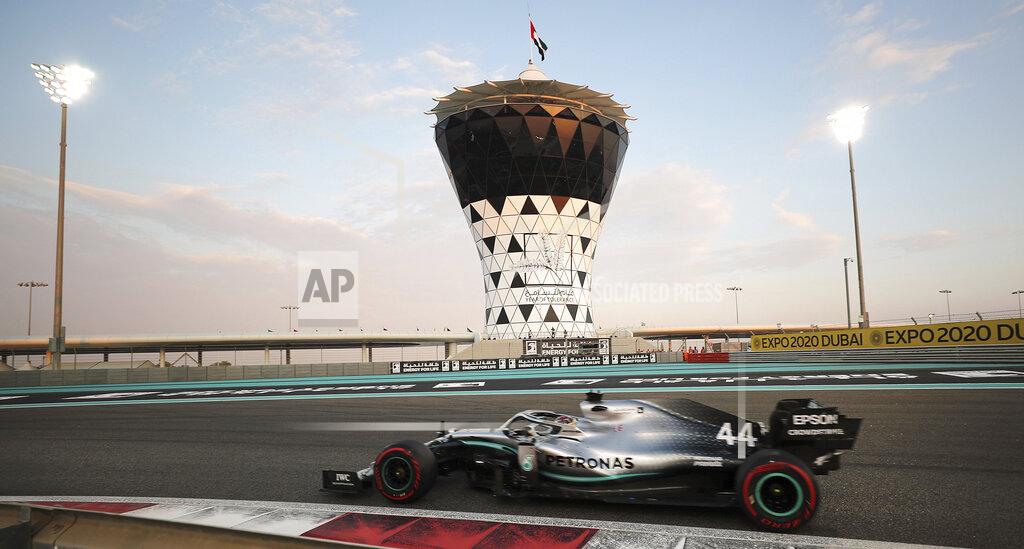 Kamran Jebreili Mercedes driver Lewis Hamilton of Britain steers his car during the qualifying session at the Yas Marina racetrack in Abu Dhabi, United Arab Emirates, Saturday, Nov. 30, 2019. The Emirates Formula One Grand Prix will take place on Sunday. (AP Photo/Kamran Jebreili)