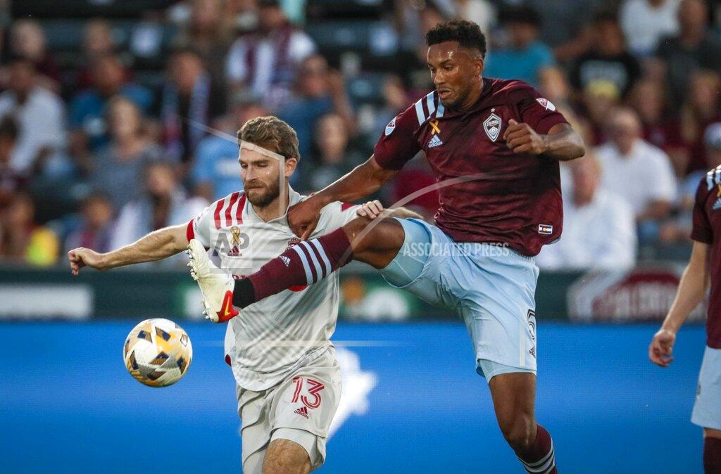 Joe Mahoney Toronto FC forward Patrick Mullins (13) chases the ball against Colorado Rapids defender Auston Trusty in the first half of an MLS soccer game in Denver, Saturday, Sept. 25, 2021. (AP Photo/Joe Mahoney)