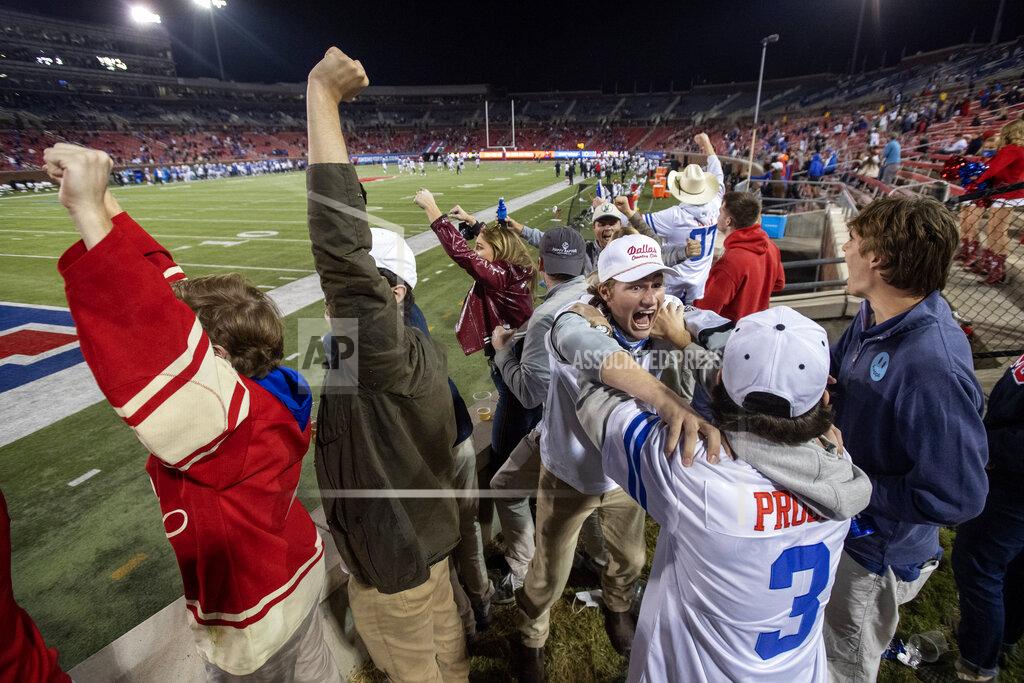 Jeffrey Mcwhorter Fans in the SMU students section cheer during the second half of an NCAA college football game against Cincinnati Saturday, Oct. 24, 2020, in Dallas. Cincinnati won 42-13. (AP Photo/Jeffrey McWhorter)