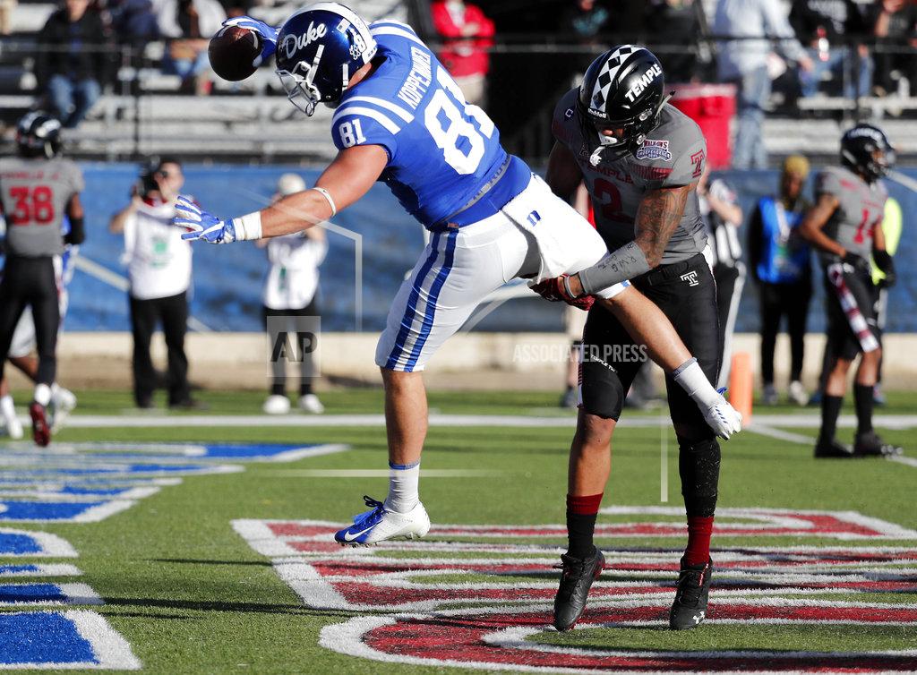 Rogelio V. Solis Temple safety Delvon Randall (2) upends Duke tight end Davis Koppenhaver (81) as he scores on a 4-yard pass in the second half of the Independence Bowl NCAA college football game in Shreveport, La., Thursday, Dec. 27, 2018. (AP Photo/Rogelio V. Solis)