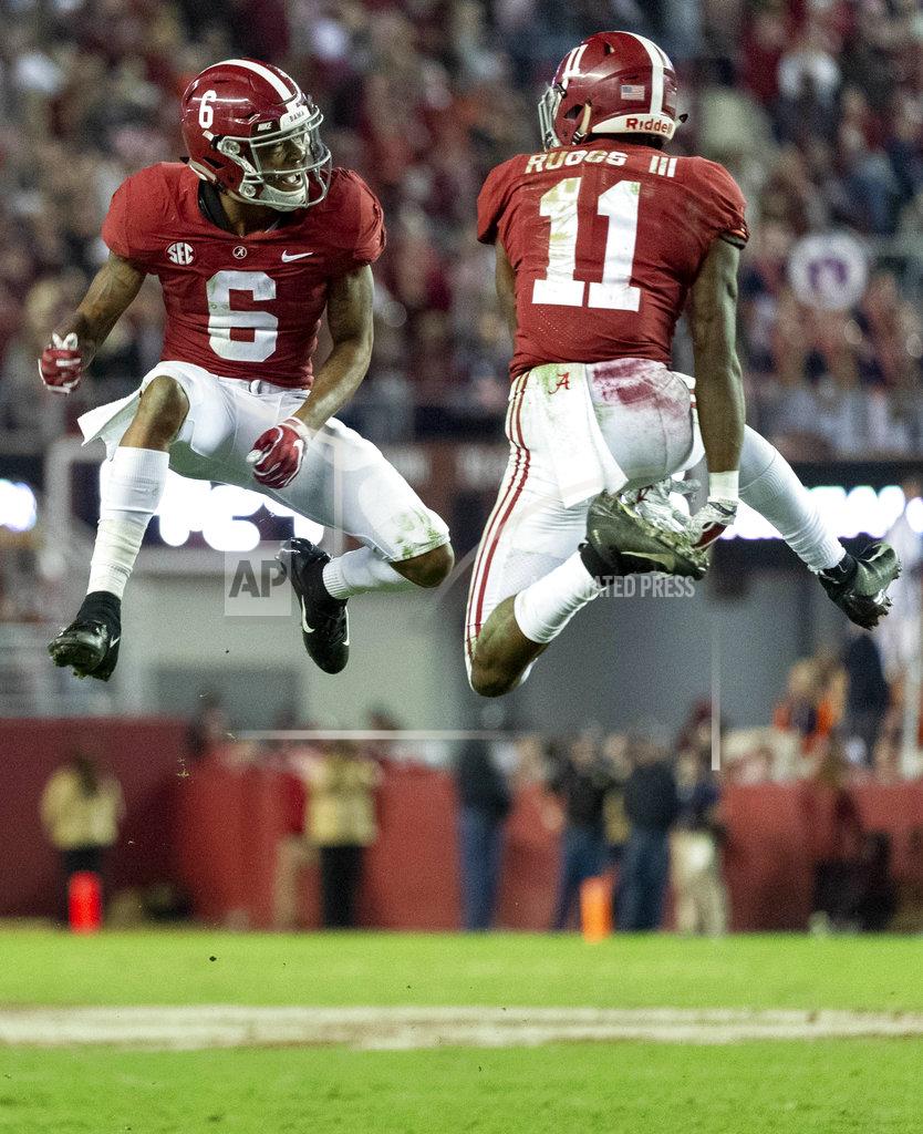 Vasha Hunt Alabama wide receivers DeVonta Smith (6) and Henry Ruggs III (11) celebrate a touchdown reception by Ruggs during the second half of an NCAA college football game against Auburn, Saturday, Nov. 24, 2018, in Tuscaloosa, Ala. (AP Photo/Vasha Hunt)