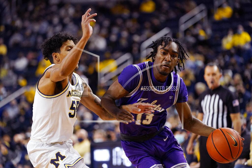 Carlos Osorio Tarleton State guard Shakur Daniel (13) is defended by Michigan guard Eli Brooks (55) during the first half of an NCAA college basketball game, Wednesday, Nov. 24, 2021, in Ann Arbor, Mich. (AP Photo/Carlos Osorio)