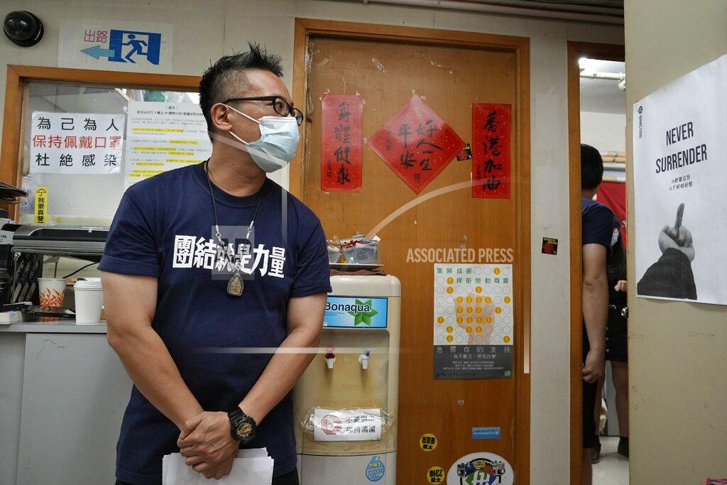Vincent Yu Hong Kong Confederation of Trade Unions President Joe Wong Nai-yuen takes a quiet moment before a news conference on the possibility of disbandment in Hong Kong Sunday, Sept. 19, 2021. Hong Kong's biggest opposition trade union said Sunday it would disband, following concerns for "members' personal safety." (AP Photo/Vincent Yu)