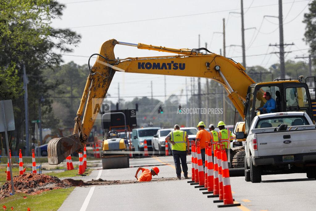 Gerald Herbert In this March 12, 2020, workers perform roadwork funded by money from BP due to the Deepwater Horizon oil spill, in Orange Beach, Ala. As oil spewed into the Gulf of Mexico from a blown-out BP well in 2010, residents wondered whether their home would ever be the same. The Deepwater Horizon disaster changed the region, with a flood of spending altering landscapes and attitudes. (AP Photo/Gerald Herbert)