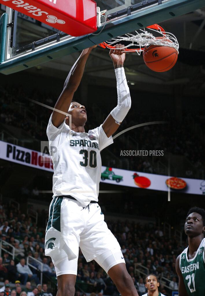 Al Goldis Michigan State's Marcus Bingham Jr. (30) dunks against Eastern Michigan's Boubacar Toure during the second half of an NCAA college basketball game, Saturday, Dec. 21, 2019, in East Lansing, Mich. (AP Photo/Al Goldis)