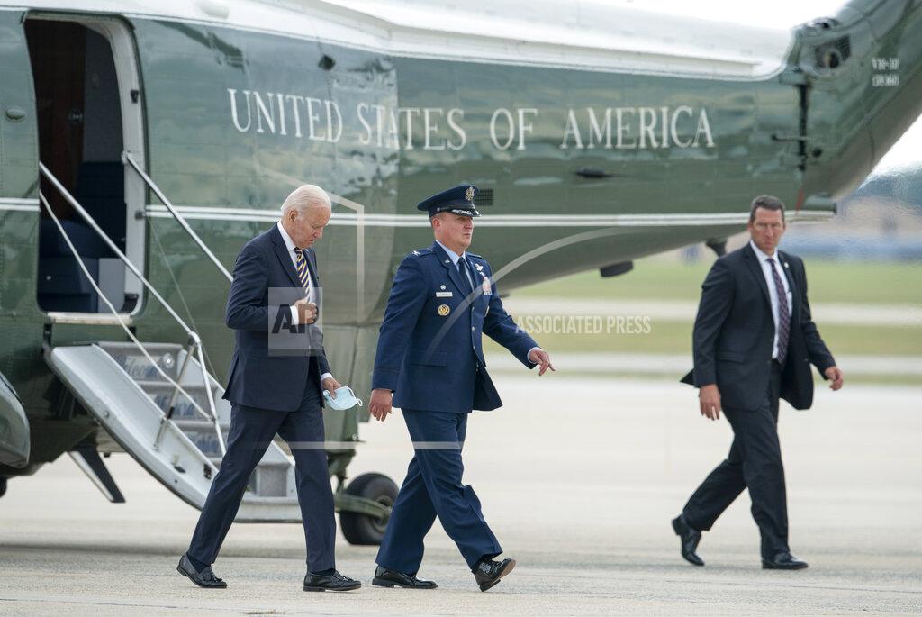 Gemunu Amarasinghe President Joe Biden, escorted by Col. Matthew Jones, Commander, 89th Airlift Wing, walks from Marine One to board Air Force One for a trip to Cleveland to deliver remarks on the American Rescue Plan, Wednesday, July 6, 2022, in Andrews Air Force Base, Md. (AP Photo/Gemunu Amarasinghe)