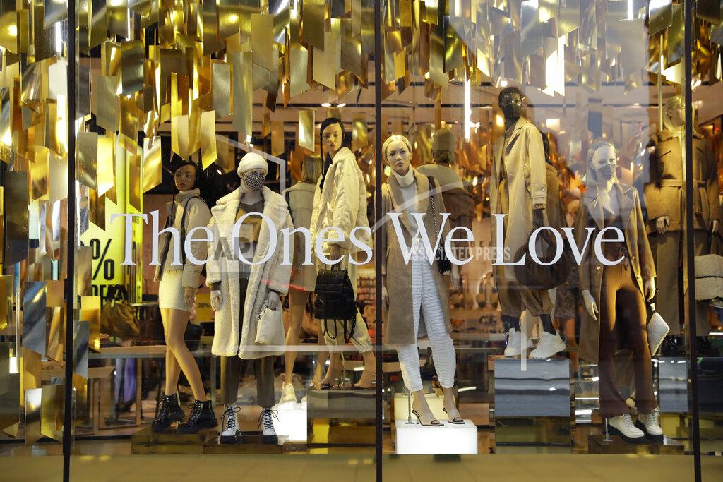 Matt Dunham Mannequins, some wearing face masks, display clothes in the front window of the temporarily closed Topshop flagship store on Oxford Street, during England's second coronavirus lockdown, in London, Monday, Nov. 30, 2020. Arcadia Group, the retail empire of tycoon Philip Green, which owns well-known British fashion chains like Topshop and employs around 15,000 people, appears to be on the brink of collapse following the economic shock of the coronavirus pandemic. (AP Photo/Matt Dunham)