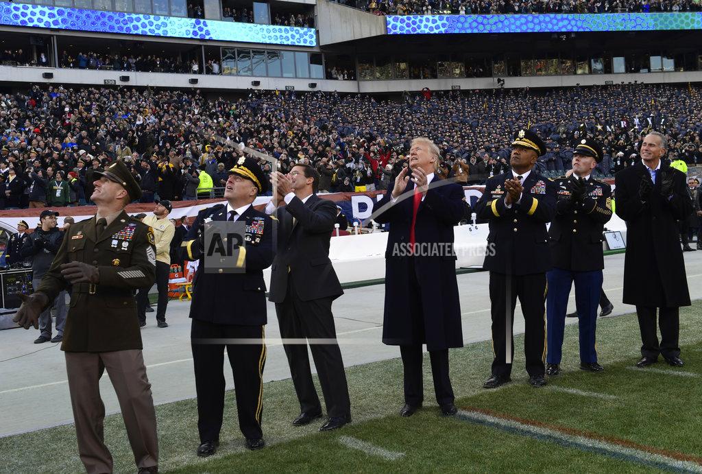 Susan Walsh President Donald Trump, center, watches a flyover before the start of the Army-Navy NCAA college football game in Philadelphia, Saturday, Dec. 8, 2018. Army Chief of Staff Gen. Mark Milley watches second from left. (AP Photo/Susan Walsh)