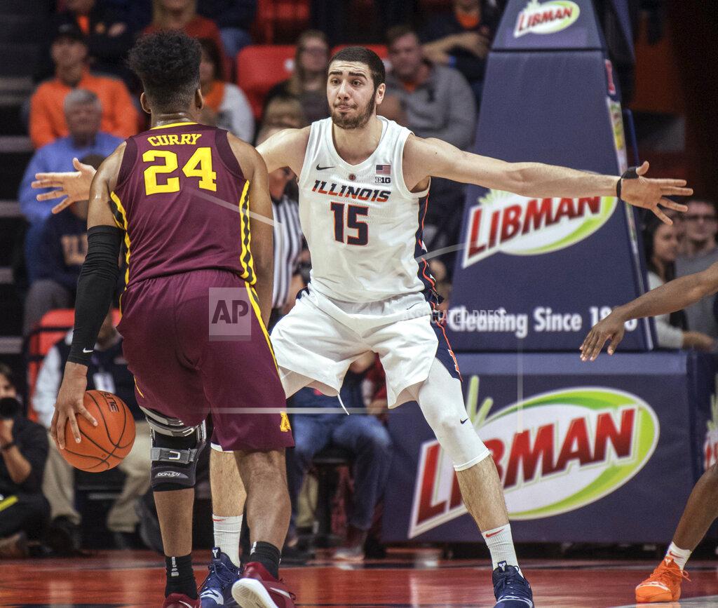 Rick Danzl Illinois forward Giorgi Bezhanishvili (15) defends against Minnesota forward Eric Curry (24) during the first half of an NCAA college basketball game in Champaign, Ill., Wednesday, Jan. 16, 2019. (AP Photo/Rick Danzl)